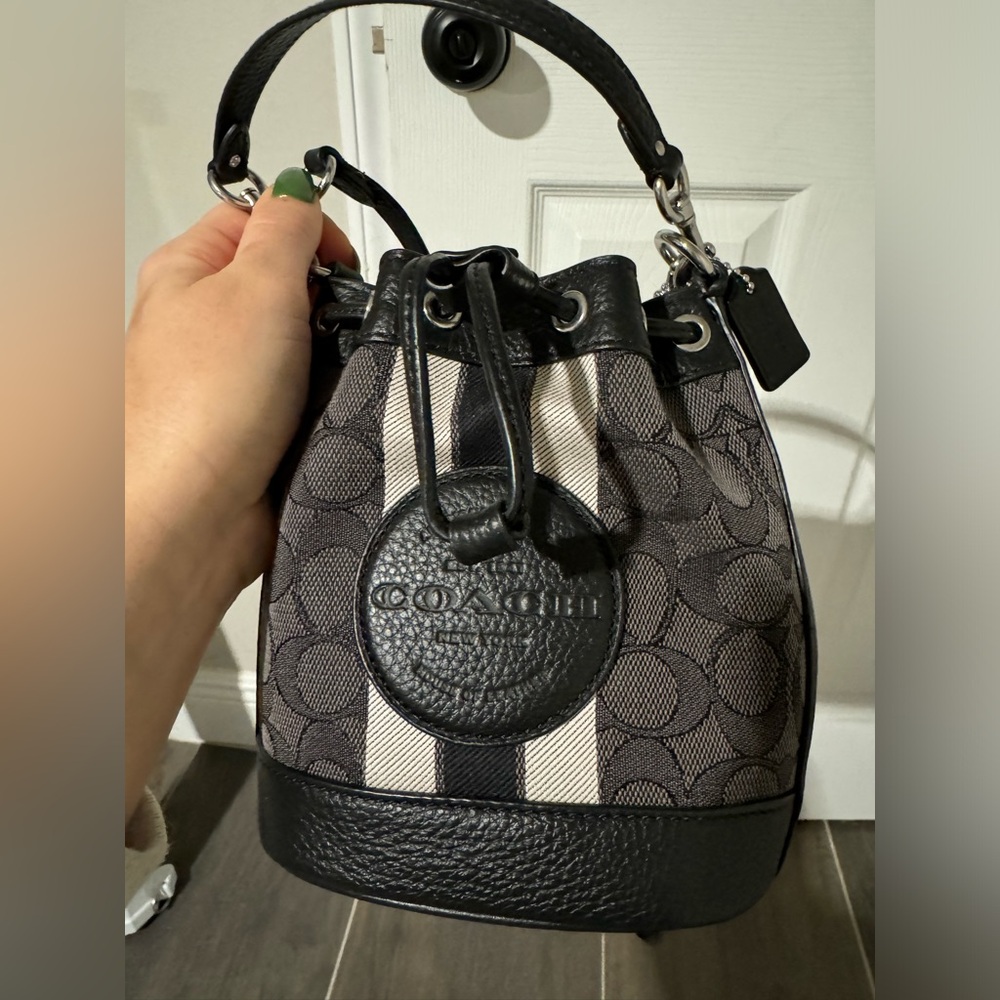 Small coach bucket bag